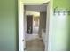 View into bathroom with tiled floor, walk in shower, white vanity and neutral wall color at 35 Mark Twain Ln, Rotonda West, FL 33947