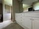Bathroom with double vanity and walk in shower at 35 Mark Twain Ln, Rotonda West, FL 33947