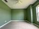 Light-filled bedroom features tile floors and a ceiling fan at 35 Mark Twain Ln, Rotonda West, FL 33947