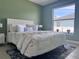 Stylishly furnished bedroom with a large window that allows for natural light at 35 Mark Twain Ln, Rotonda West, FL 33947