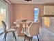 Cozy dining area featuring a modern round table and plush chairs at 35 Mark Twain Ln, Rotonda West, FL 33947