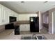 Well-equipped kitchen with white cabinets, offering lots of counter space and storage at 35 Mark Twain Ln, Rotonda West, FL 33947