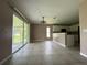 Open-concept kitchen and dining area with tile floors and ample natural light at 35 Mark Twain Ln, Rotonda West, FL 33947