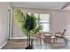 Inviting seating area with a decorative plant that brings the outdoors in at 35 Mark Twain Ln, Rotonda West, FL 33947