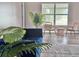 Cozy living room features modern furnishings, a plush sofa, and natural light, creating an inviting space at 35 Mark Twain Ln, Rotonda West, FL 33947