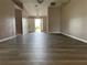 Spacious living room that leads to the entryway, showcasing the home's open layout at 35 Mark Twain Ln, Rotonda West, FL 33947