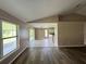 Spacious living room with a blend of tile and wood flooring, great for entertaining at 35 Mark Twain Ln, Rotonda West, FL 33947