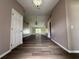 Open living space with wood floors and neutral paint offers ample natural light at 35 Mark Twain Ln, Rotonda West, FL 33947