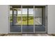 Balcony doors opening to a scenic view of lush greenery and a tranquil bay at 6000 Boca Grande Cswy # D46, Boca Grande, FL 33921