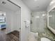 The bathroom features a glass enclosed shower and marble floors at 6000 Boca Grande Cswy # D46, Boca Grande, FL 33921