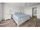 Bright bedroom features a ceiling fan and an en-suite bath at 6000 Boca Grande Cswy # D46, Boca Grande, FL 33921