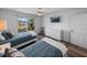 Bright bedroom features two twin beds, wood-look floors and a large window with a view at 6000 Boca Grande Cswy # D46, Boca Grande, FL 33921