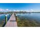 Wooden community dock perfect for fishing and boat watching on a clear sunny day at 6000 Boca Grande Cswy # D46, Boca Grande, FL 33921