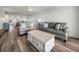 Comfortable living room with plush sofas, stylish decor, and an open layout to the kitchen and dining area at 6000 Boca Grande Cswy # D46, Boca Grande, FL 33921