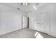 Bright bedroom with a modern ceiling fan and a classic double-door closet at 9262 Genesee St, Port Charlotte, FL 33981