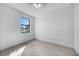 Bright bedroom with a view of the backyard from a large window at 9262 Genesee St, Port Charlotte, FL 33981