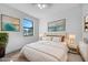 Comfortable bedroom features a large window, neutral colors, and decorative furnishing at 9262 Genesee St, Port Charlotte, FL 33981