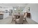 Open concept kitchen and dining room with new stainless appliances and a dining table at 9262 Genesee St, Port Charlotte, FL 33981