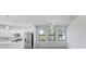 Modern kitchen with stainless steel appliances, white cabinets, and stylish pendant lighting at 9262 Genesee St, Port Charlotte, FL 33981