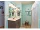 Charming bathroom with light teal walls and updated vanity at 6432 Keena Ct, North Port, FL 34287