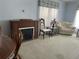 Living room with fireplace, seating area, and large windows at 6432 Keena Ct, North Port, FL 34287