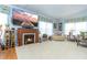 Spacious living room featuring a large TV, fireplace and comfortable seating at 6432 Keena Ct, North Port, FL 34287