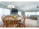 Dining room with wood table, chairs, and chandelier at 6432 Keena Ct, North Port, FL 34287