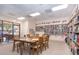 Inviting community room with bookshelves, tables, and chairs at 6432 Keena Ct, North Port, FL 34287