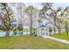 Peaceful gazebo overlooking a pond in a tree-lined area at 6432 Keena Ct, North Port, FL 34287