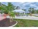 Outdoor shuffleboard courts and shaded seating area at 6432 Keena Ct, North Port, FL 34287