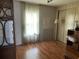 Bright guest room with wood floors and ample closet space at 6432 Keena Ct, North Port, FL 34287