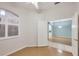 Bedroom with wood floors and access to other rooms at 2024 Lynx Run, North Port, FL 34288