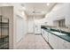 White kitchen with green countertops and stainless steel appliances at 2024 Lynx Run, North Port, FL 34288