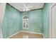 Bedroom with light green walls, wood floors, and a window at 2024 Lynx Run, North Port, FL 34288