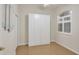 Bedroom with built-in white wardrobe and window at 2024 Lynx Run, North Port, FL 34288