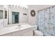 Small bathroom with white vanity and shower at 2024 Lynx Run, North Port, FL 34288