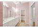 Double vanity bathroom with pink walls and a toilet at 2024 Lynx Run, North Port, FL 34288