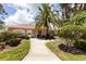Community center with landscaped grounds and walkway at 2024 Lynx Run, North Port, FL 34288