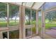 Bright sunroom with view of lush green landscape at 2024 Lynx Run, North Port, FL 34288