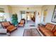 Sunroom with comfortable seating and access to backyard at 417 Tomoka Dr, Englewood, FL 34223