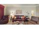 Living room with leather sofas and a view of the lanai at 417 Tomoka Dr, Englewood, FL 34223