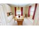 Charming breakfast nook with wood table and chairs, perfect for morning meals at 417 Tomoka Dr, Englewood, FL 34223