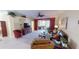 Living room with a view into the kitchen area at 417 Tomoka Dr, Englewood, FL 34223