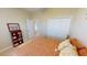 Bedroom with double bed, bookshelf, and ample closet space at 417 Tomoka Dr, Englewood, FL 34223