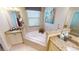 Spa-like bathroom with corner soaking tub, granite vanity and a walk-in shower at 417 Tomoka Dr, Englewood, FL 34223