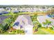 Aerial view of a house with lush landscaping at 417 Tomoka Dr, Englewood, FL 34223