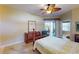 Bright bedroom with a double bed and access to a private patio at 417 Tomoka Dr, Englewood, FL 34223