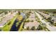 Aerial view of houses and a canal at 417 Tomoka Dr, Englewood, FL 34223