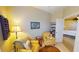 Relaxing office space with yellow armchairs and a view of another room at 417 Tomoka Dr, Englewood, FL 34223