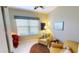 Cozy office with two armchairs, a side table and large window at 417 Tomoka Dr, Englewood, FL 34223